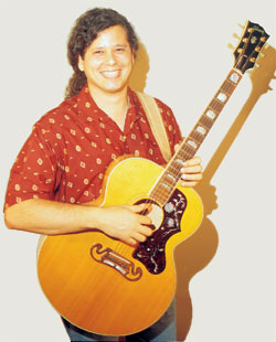 Joe with acoustic guitar
